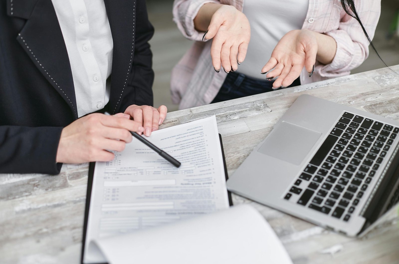 Financial advisor explaining insurance options to clients